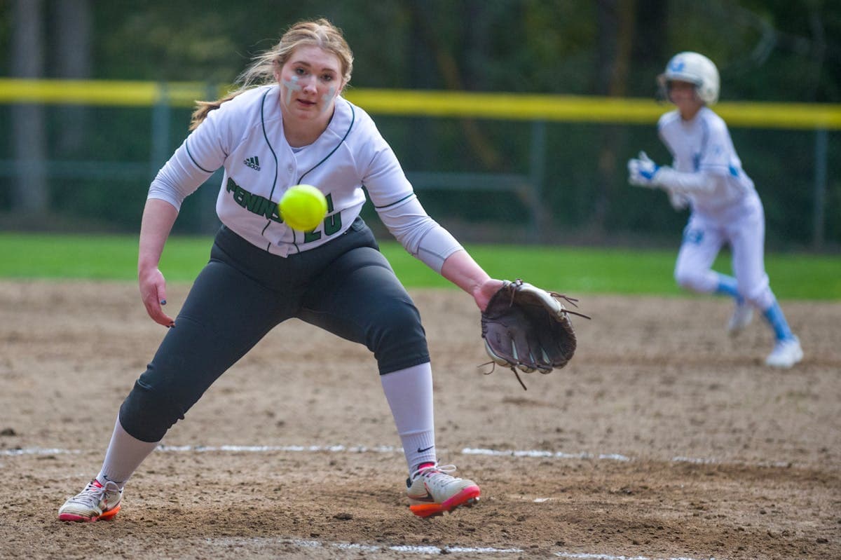 Softball player fielding a ground ball