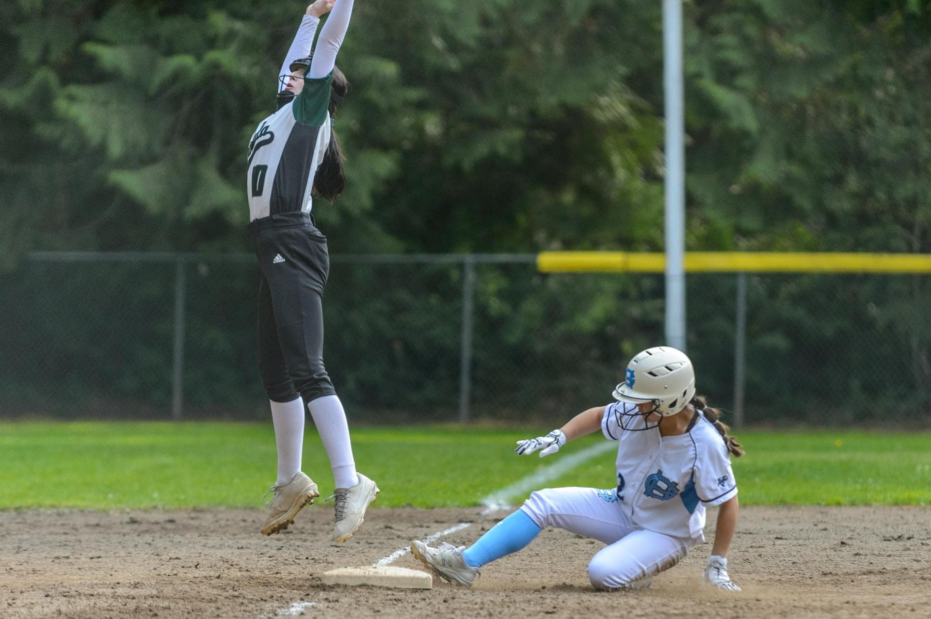 Softball players in action during a game